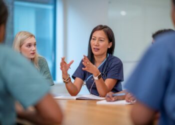 A picture containing person, indoor, wall Description automatically generated